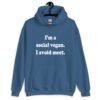 Indigo blue hoodie sweatshirt with the pun phrase 'I'm a social vegan. I avoid meet.' printed on the front.
