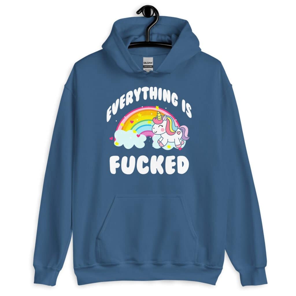 Indigo blue hoodie sweatshirt with a graphic of a kawaii style unicorn and a pastel rainbow with the text 'Everything is fucked' printed on the front.