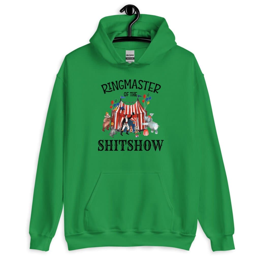 Irish green hoodie sweatshirt with a circus theme graphic and the text 'Ringmaster of the Shitshow' printed on the front.