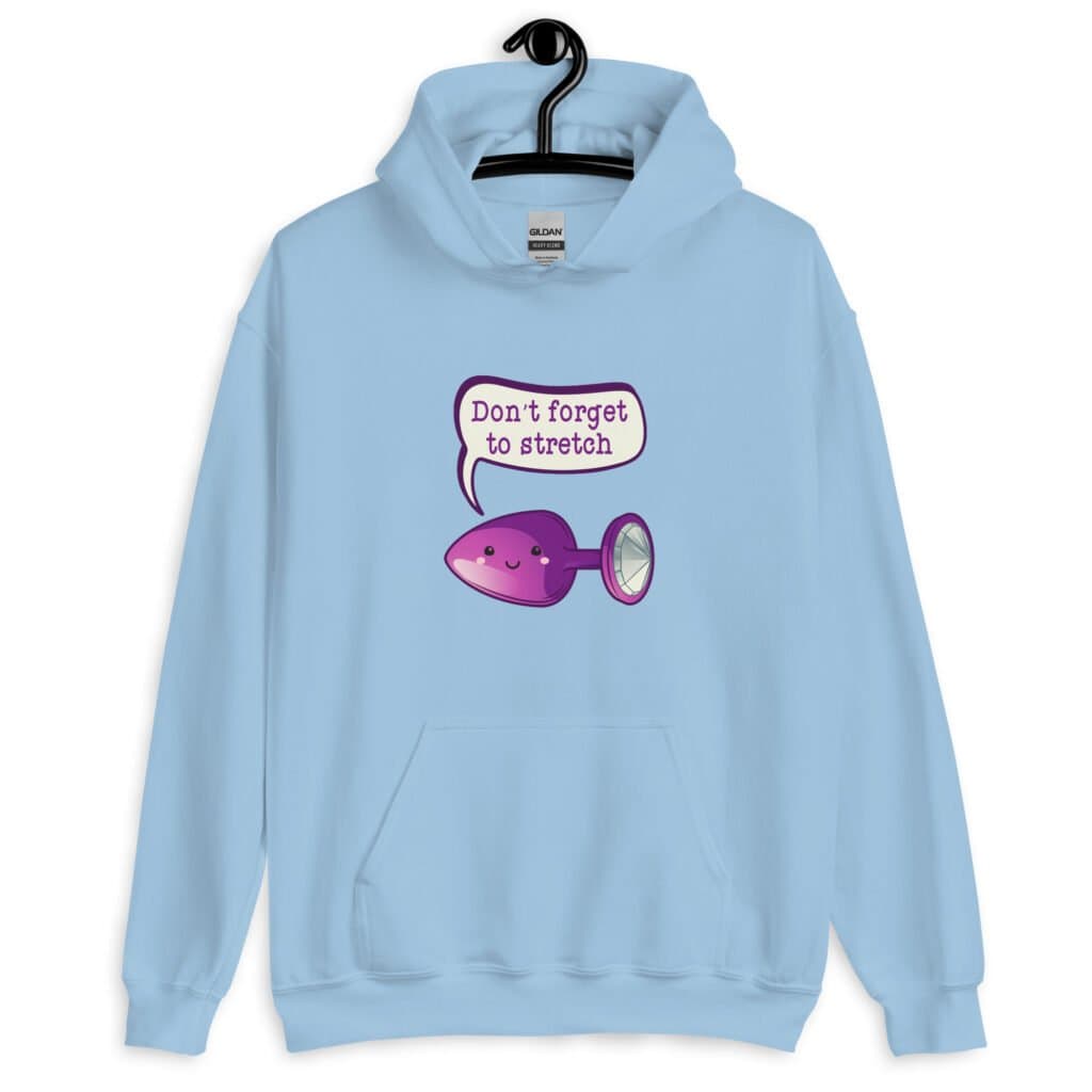 Light blue hoodie sweatshirt that has image of a purple anal plug with a smile face with a speech bubble above with the words 'Don't forget to stretch'. The graphics are printed on the front of the hoodie.