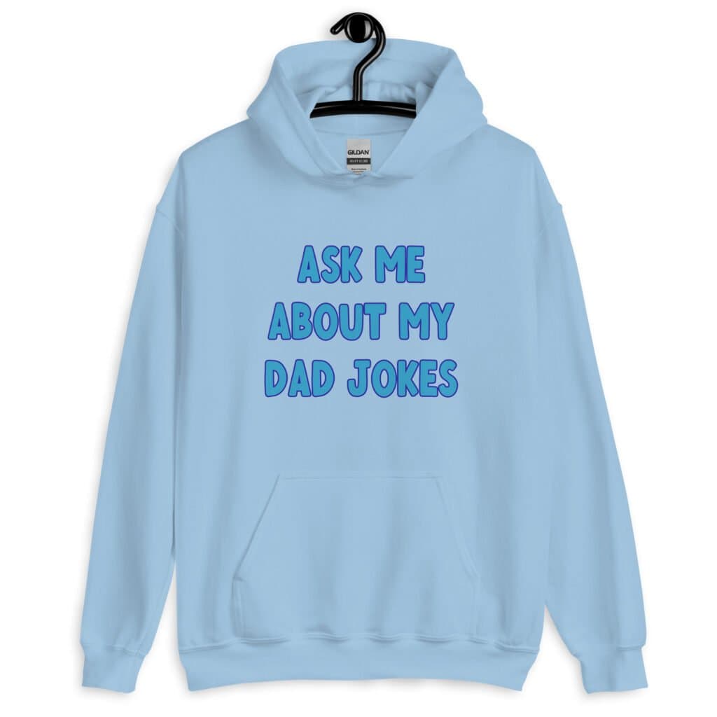 Light blue hoodie sweatshirt with the text 'Ask me about my Dad jokes' printed on the front.