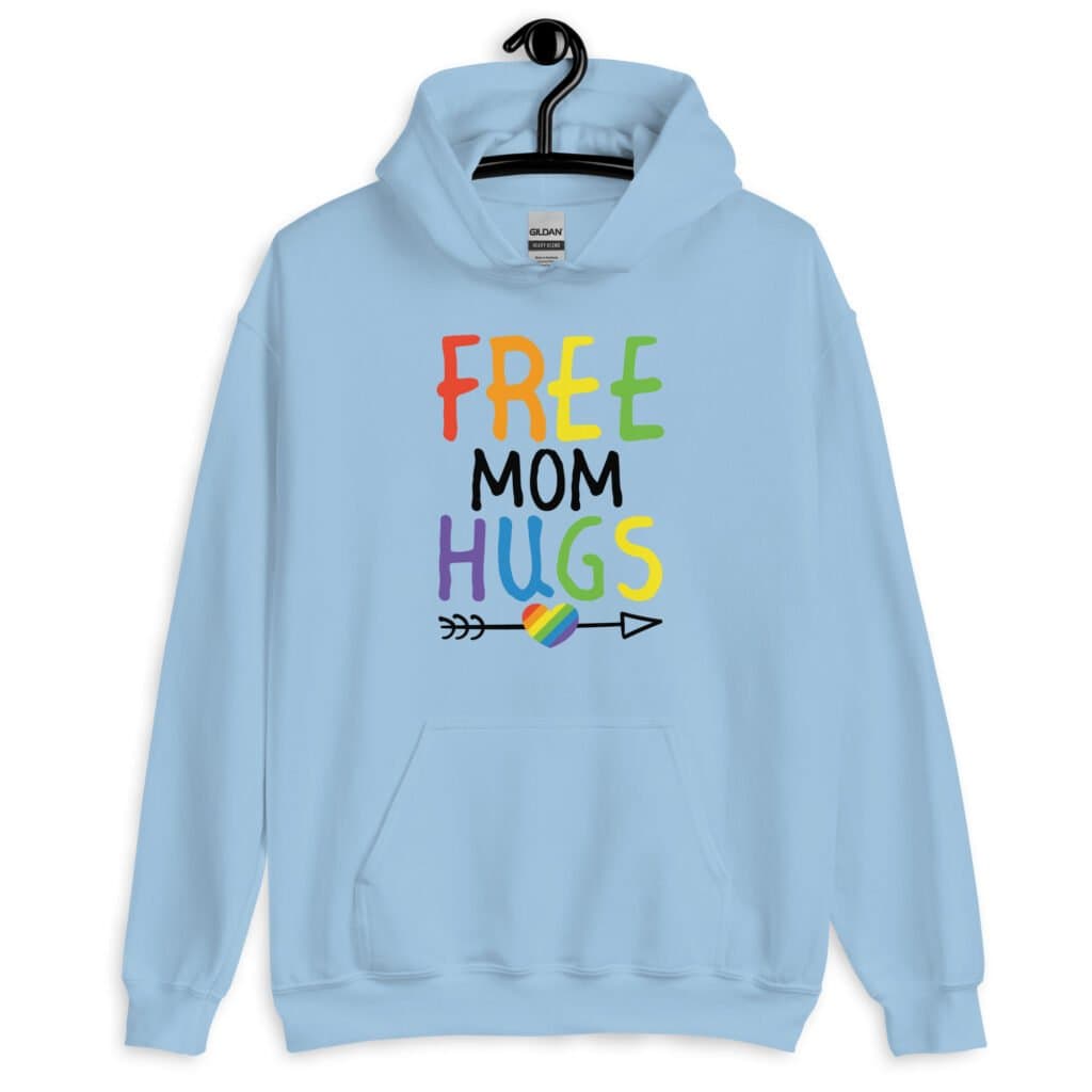 Light blue hoodie sweatshirt with the text 'Free Mom hugs' in rainbow lettering printed on the front.