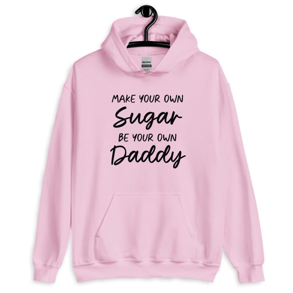 Light pink hoodie sweatshirt with the text 'Make your own sugar Be your own Daddy' printed on the front.