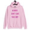 Light pink hoodie sweatshirt with the words 'Women don't owe you shit' printed on the front in pink.