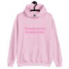 Light pink hoodie sweatshirt with the text 'The boobs are real, the smile is fake.' printed in pink on the front.