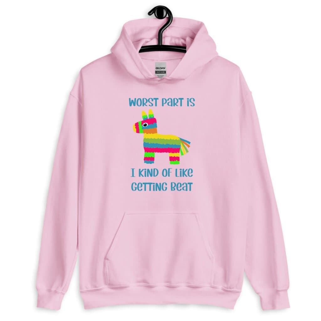 Light pink hoodie sweatshirt with an image of a colorful donkey pinata with the words 'Worst part is I kind of like getting beat' printed on the front.