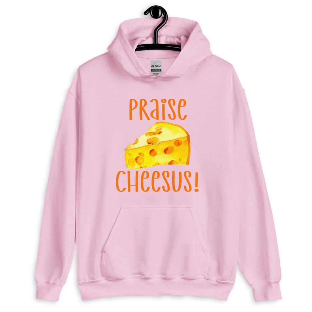 Light pink hoodie sweatshirt with funny graphics of a piece of swiss cheese and the text 'Praise Cheesus' printed on the front of the shirt in yellow and orange.