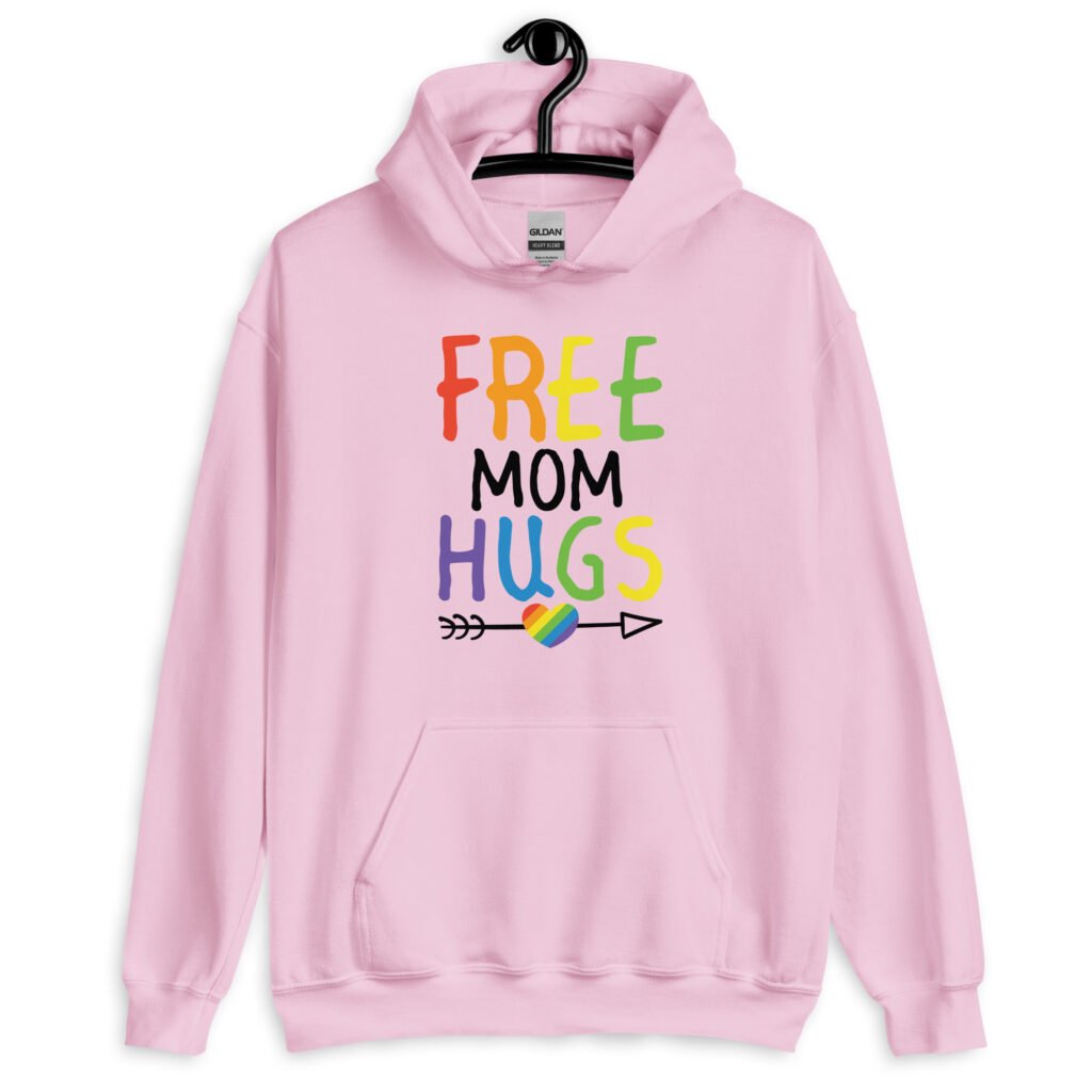 Light pink hoodie sweatshirt with the text 'Free Mom hugs' in rainbow lettering printed on the front.
