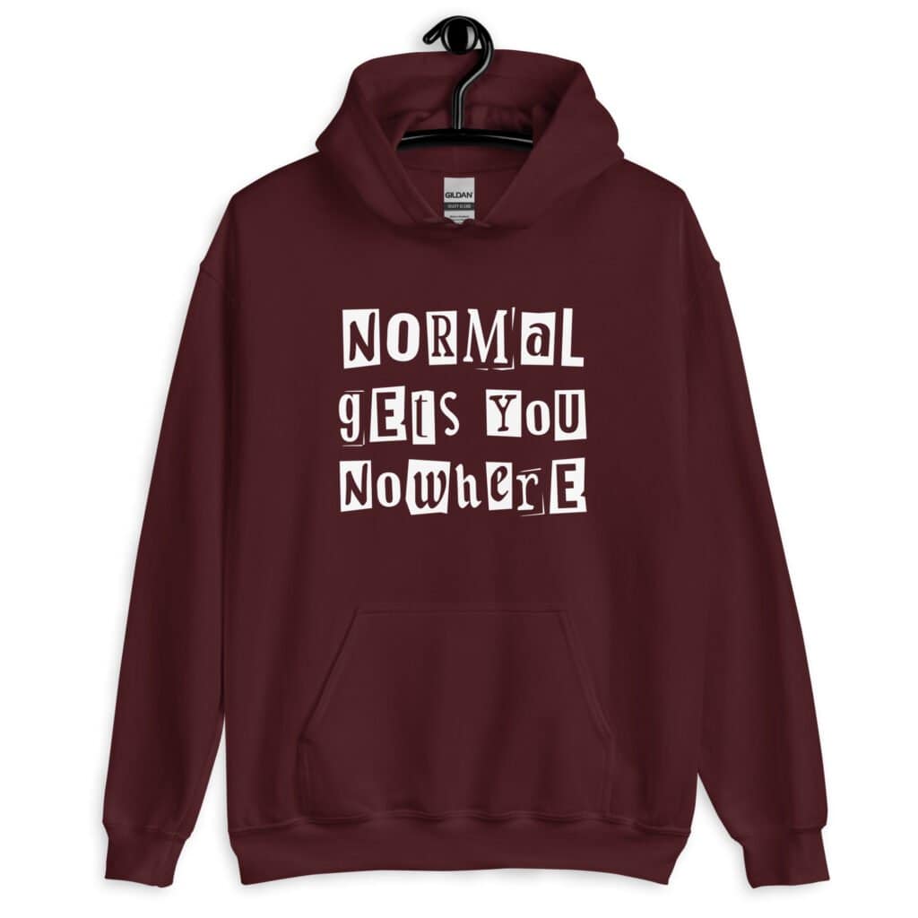Maroon hoodie sweatshirt with the phrase 'Normal gets you nowhere' printed on the front.