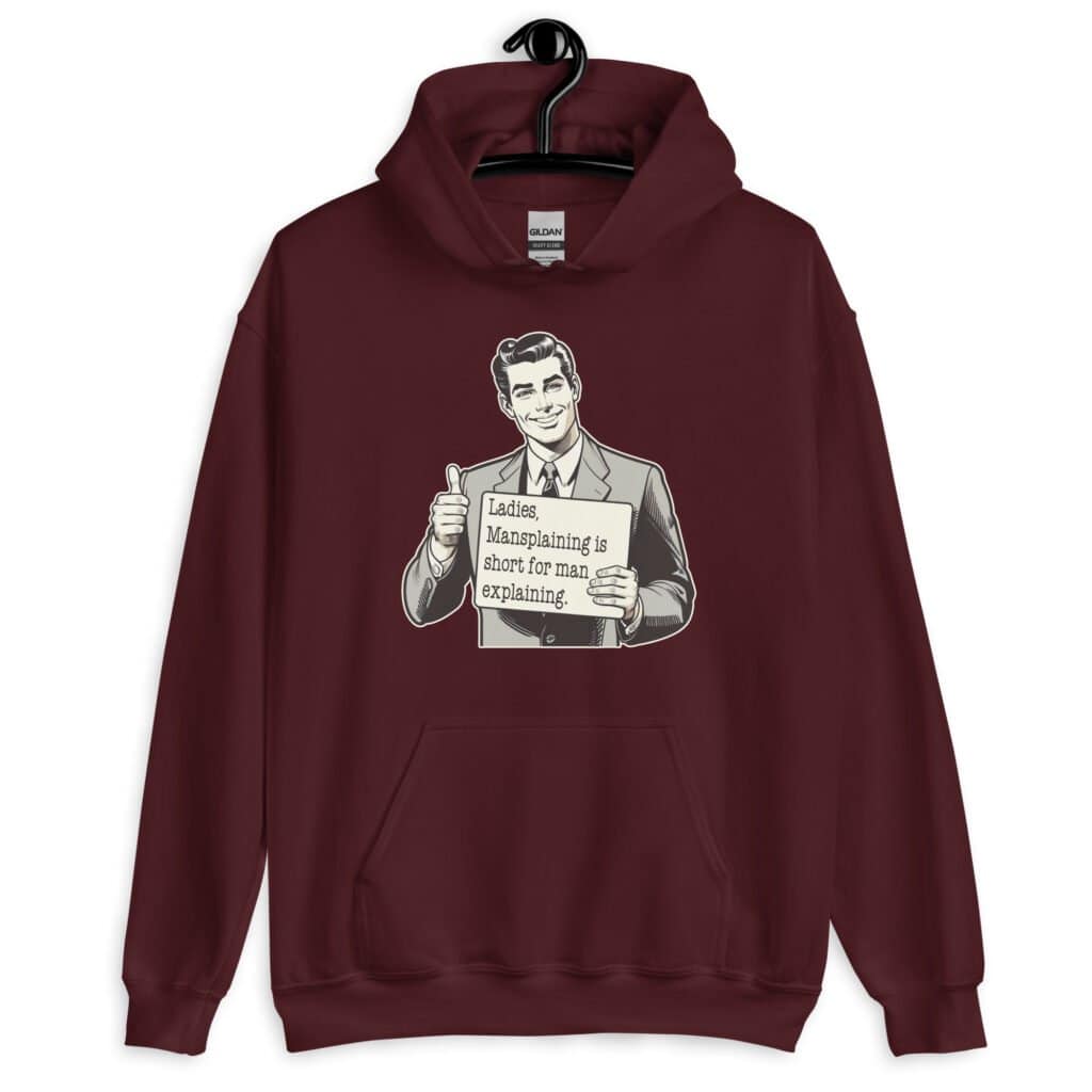 Maroon hoodie sweatshirt with graphic of a retro man holding sign that says 'Ladies, mansplaining is short for man explaining' printed on the front.