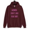 Maroon hoodie sweatshirt with the words 'Women don't owe you shit' printed on the front in pink.