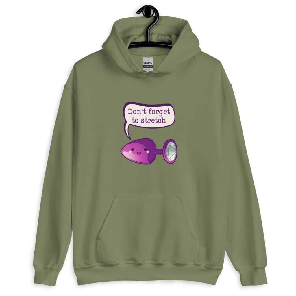 Military green hoodie sweatshirt that has image of a purple anal plug with a smile face with a speech bubble above with the words 'Don't forget to stretch'. The graphics are printed on the front of the hoodie.