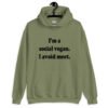 Military green hoodie sweatshirt with the pun phrase 'I'm a social vegan. I avoid meet.' printed on the front.