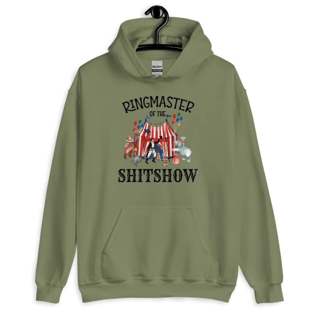 Military green hoodie sweatshirt with a circus theme graphic and the text 'Ringmaster of the Shitshow' printed on the front.