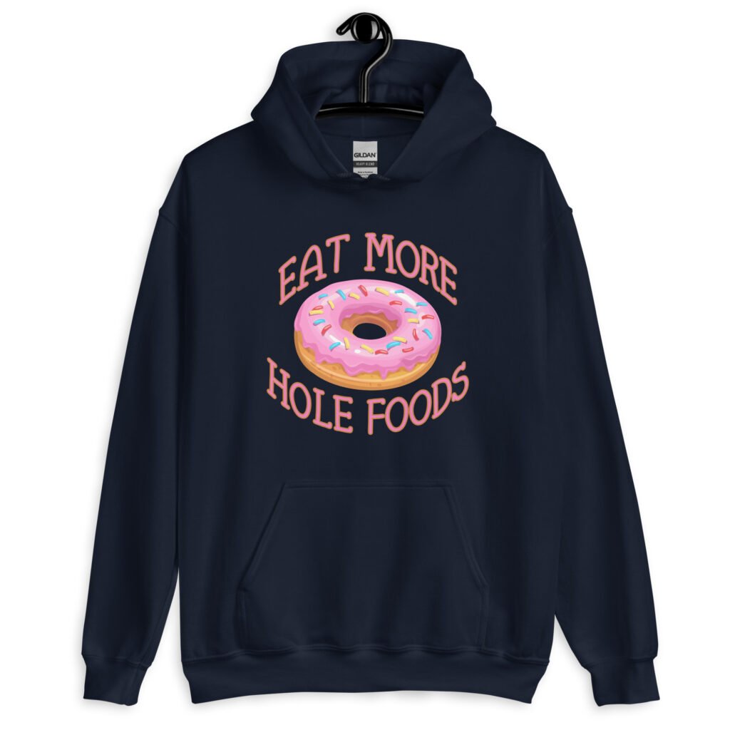 Navy blue hoodie sweatshirt with an image of a donut with pink icing and sprinkles and the text 'Eat more hole foods' printed on the front.