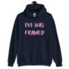 Navy blue hoodie sweatshirt with the text 'Eve was framed' printed on the front in pink.