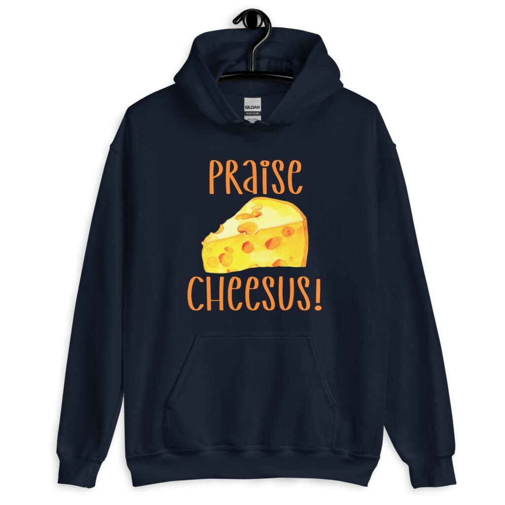 Navy blue hoodie sweatshirt with funny graphics of a piece of swiss cheese and the text 'Praise Cheesus' printed on the front of the shirt in yellow and orange.
