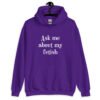 Purple hoodie sweatshirt with the text 'Ask me about my fetish' printed on the front.