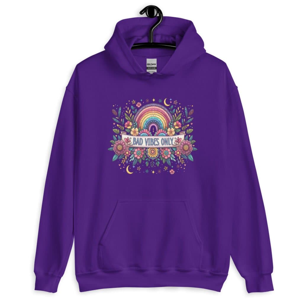 Purple hoodie sweatshirt with colorful boho floral design and the test 'Bad vibes only' printed on the front.