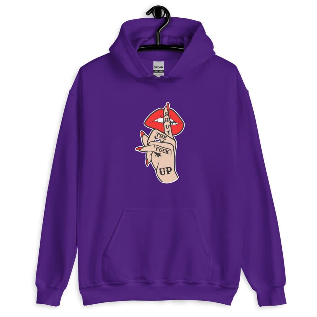 Purple hoodie sweatshirt with an image of a hand over lips making the shh gesture. The words 'Shut the fuck up' are printed on the hand. The graphics are printed on the front.