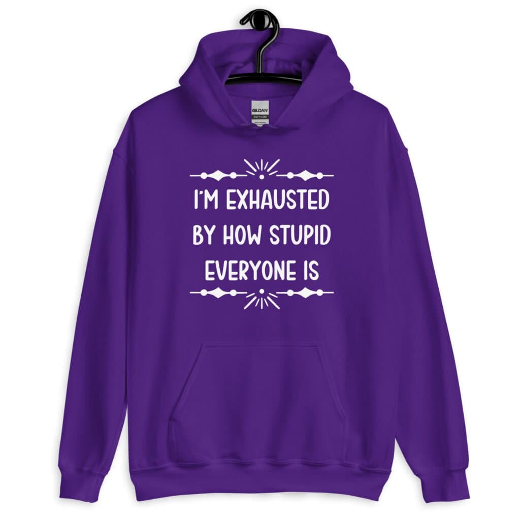 Purple t-shirt with the text 'I'm exhausted by how stupid everyone is' printed on the front.