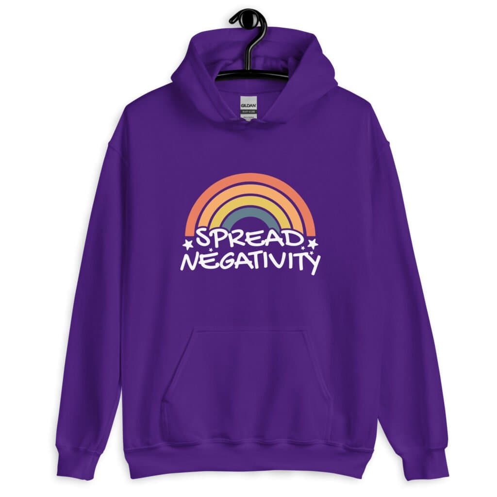 Purple hoodie sweatshirt with a graphic of a rainbow and the words 'Spread negativity' printed on the front.
