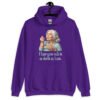 Purple hoodie sweatshirt with an image of grey haired older woman enjoying a bite of a piece of cake with the words 'I hope your cake is as moist as I am' printed on the front.