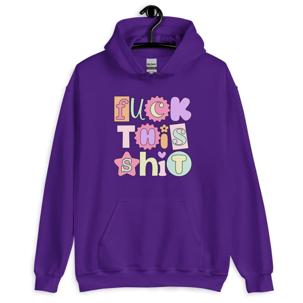 Purple hoodie sweatshirt with colorful pastel font 'Fuck this shit' graphics printed on the front.