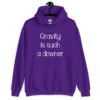 Purple hoodie sweatshirt with the text 'Gravity is such a downer' printed on the front.