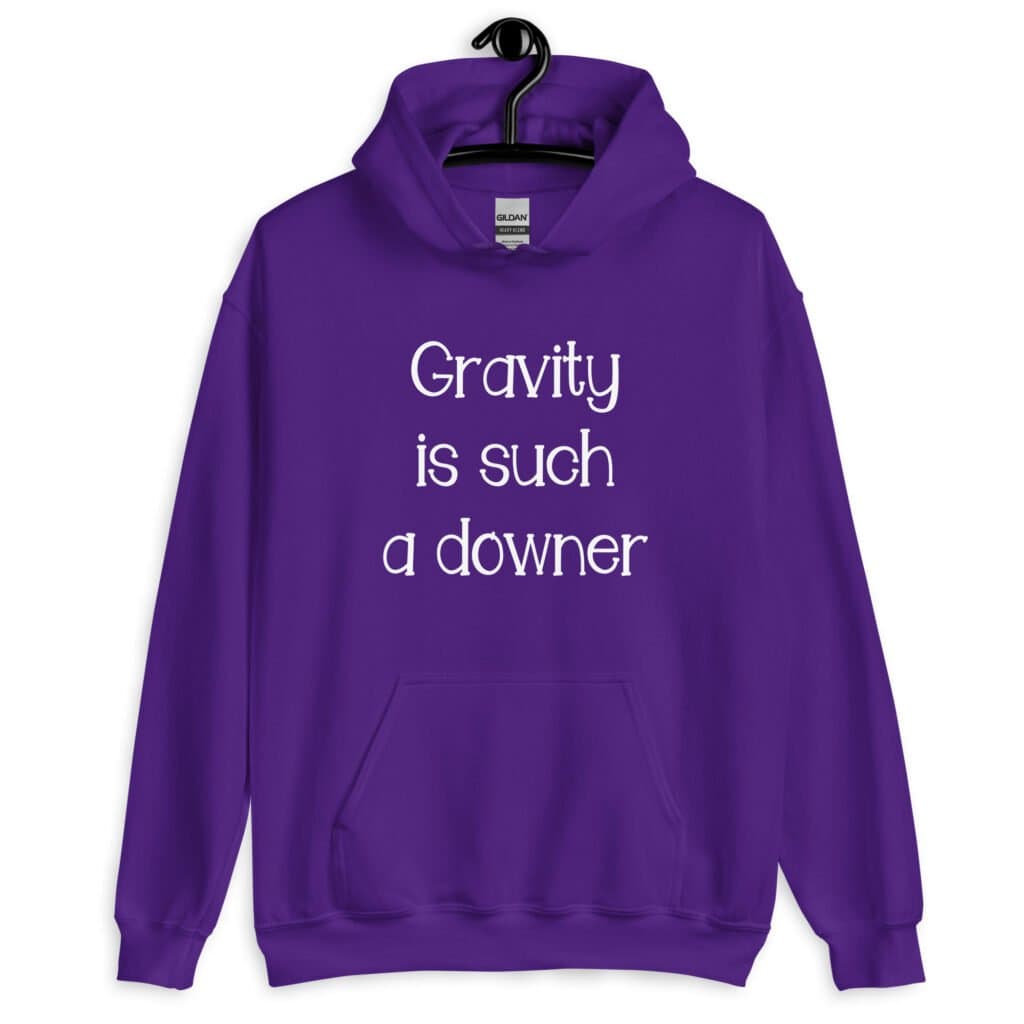 Purple hoodie sweatshirt with the text 'Gravity is such a downer' printed on the front.