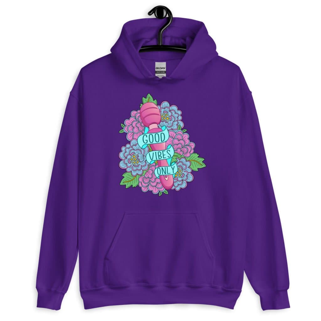 Purple hoodie sweatshirt with graphic design that has the words 'Good vibes only' layered over a pink wand vibrator with flowers around. The graphic design is printed on the front of the hoodie.
