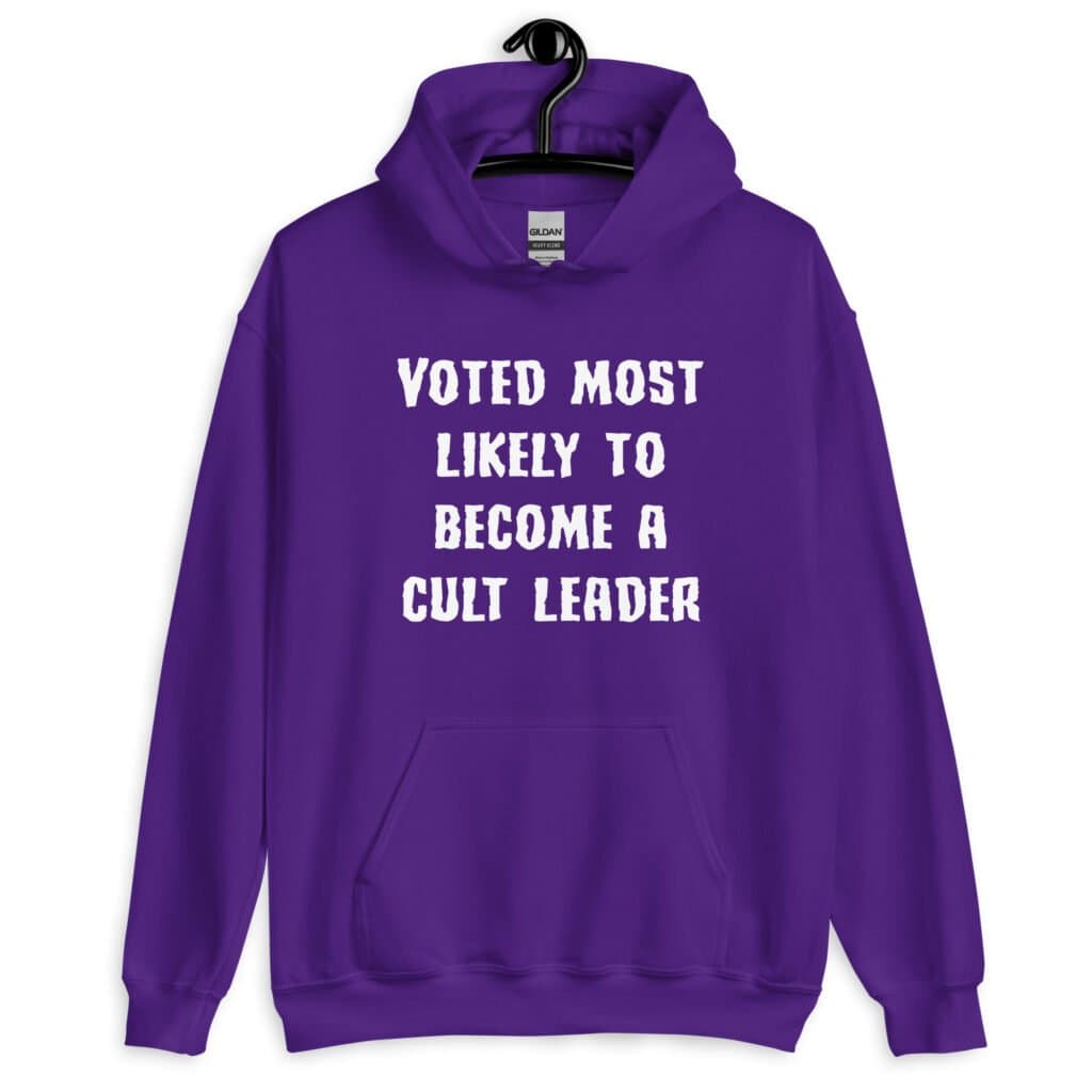 Purple hoodie sweatshirt with the text 'Voted most likely to become a cult leader' printed on the front.
