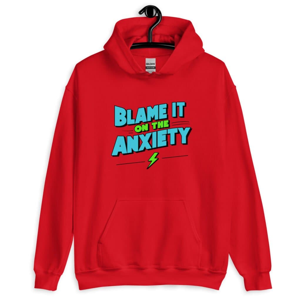 Red hoodie sweatshirt with the phrase 'Blame is on the anxiety' printed on the front. The graphics are bold and in aqua and lime green.