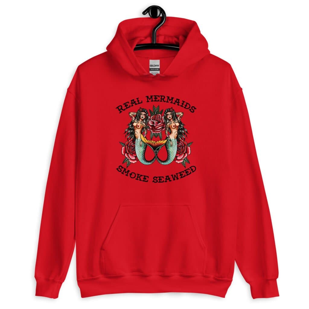 Red hoodie sweatshirt with image of 2 mermaids and the text 'Real mermaids smoke seaweed' printed on the front.