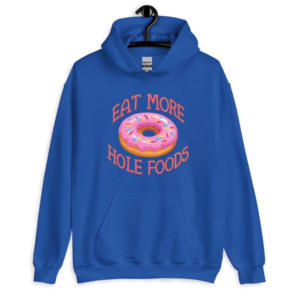 Royal blue hoodie sweatshirt with an image of a donut with pink icing and sprinkles and the text 'Eat more hole foods' printed on the front.