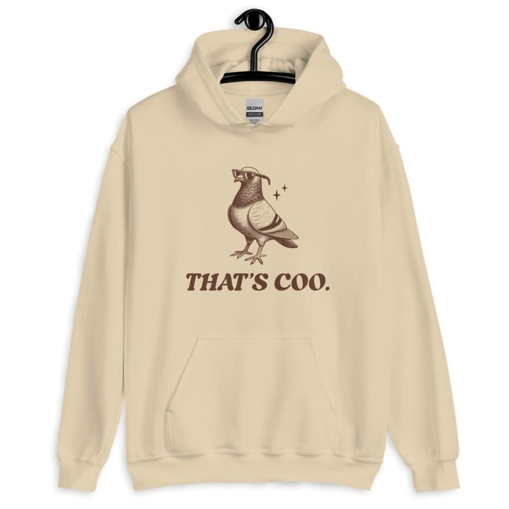 Sand color hoodie sweatshirt with an image of a pigeon and the words 'That's coo.' printed on the front.