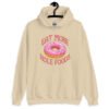 Sand color hoodie sweatshirt with an image of a donut with pink icing and sprinkles and the text 'Eat more hole foods' printed on the front.
