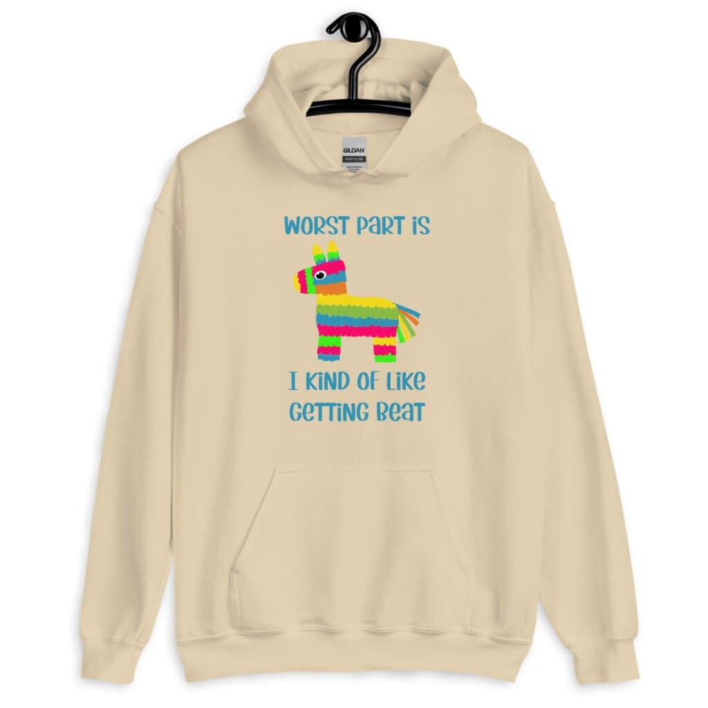 Sand color hoodie sweatshirt with an image of a colorful donkey pinata with the words 'Worst part is I kind of like getting beat' printed on the front.