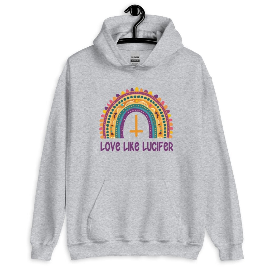 Sport grey hoodie sweatshirt with an image of a boho style rainbow. There is an upside down cross in the center arch of the rainbow and the text 'Love like Lucifer' printed under. The graphics are printed on the front.