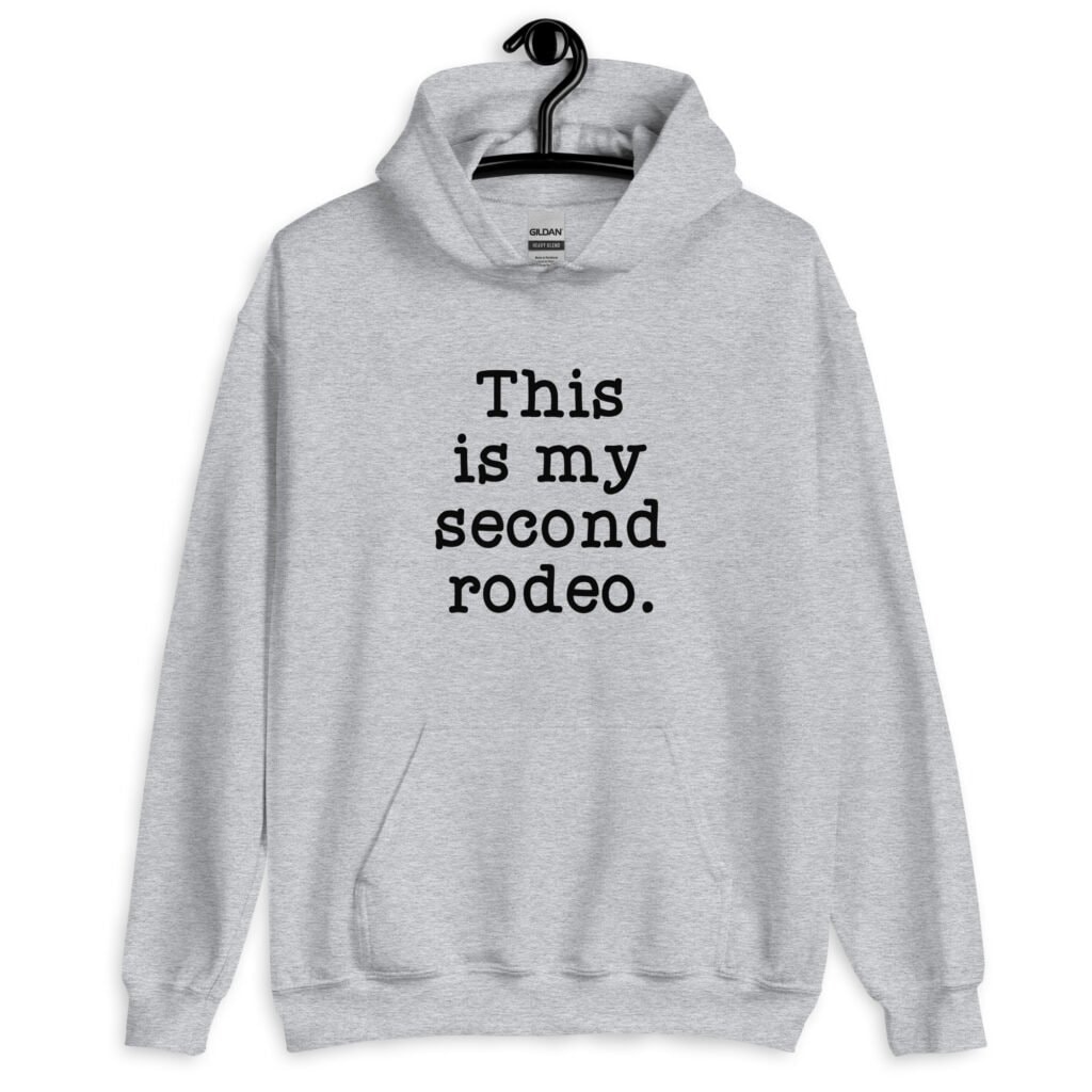 Sport grey hoodie sweatshirt with the text 'This is my second rodeo.' printed on the front.