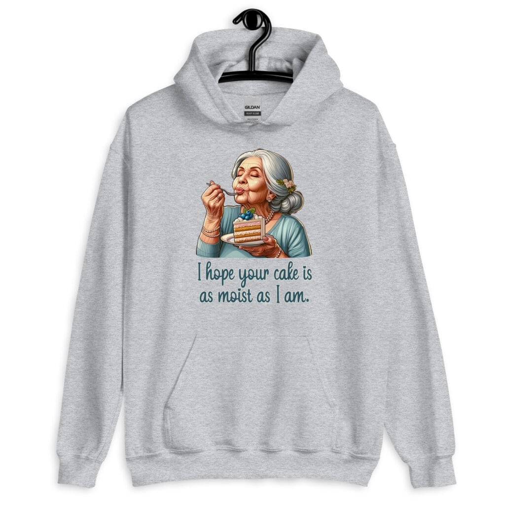 Sport grey hoodie sweatshirt with an image of grey haired older woman enjoying a bite of a piece of cake with the words 'I hope your cake is as moist as I am' printed on the front.