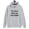 Sport grey hoodie sweatshirt with the text 'I'm nicer than my face looks' printed on the front.