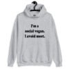 Sport grey hoodie sweatshirt with the pun phrase 'I'm a social vegan. I avoid meet.' printed on the front.