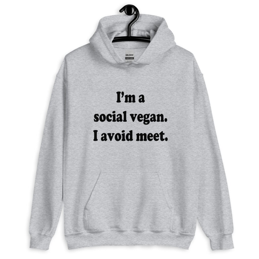 Sport grey hoodie sweatshirt with the pun phrase 'I'm a social vegan. I avoid meet.' printed on the front.