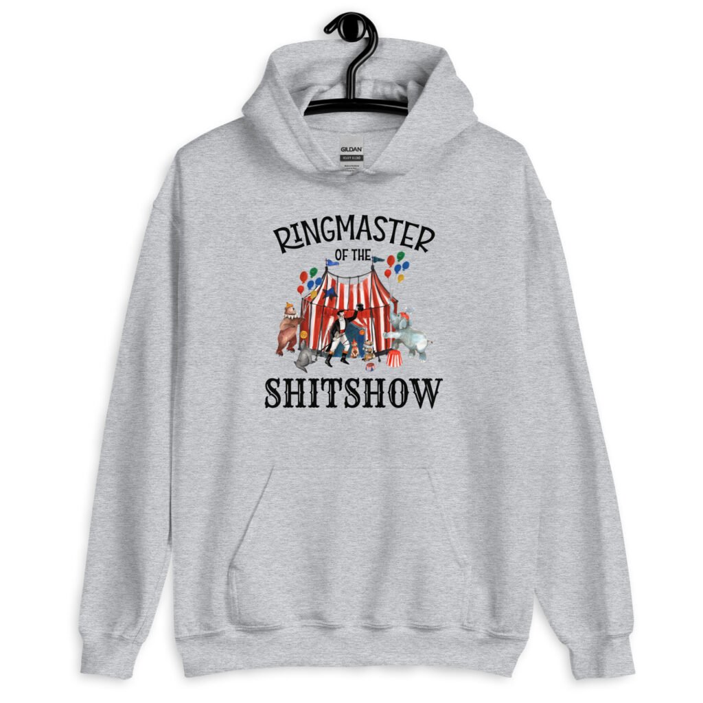 Sport grey hoodie sweatshirt with a circus theme graphic and the text 'Ringmaster of the Shitshow' printed on the front.