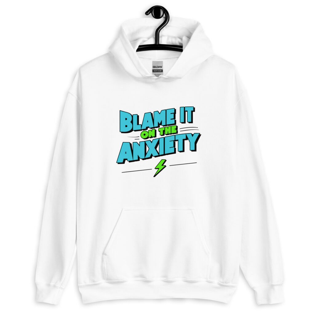 White hoodie sweatshirt with the phrase 'Blame is on the anxiety' printed on the front. The graphics are bold and in aqua and lime green.