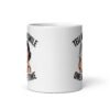 White ceramic mug with graphic of a woman holding a knife and the phrase 'Tell me to smile one more time' printed on both sides.