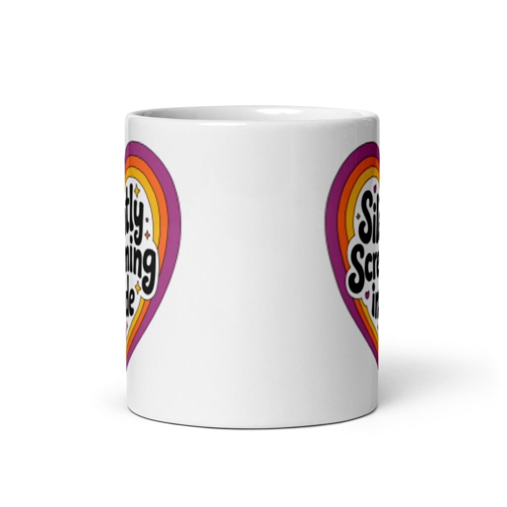 White ceramic coffee mug with a colorful graphic that says 'Silently screaming inside'. The graphics are printed on both sides of the mug.