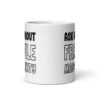 White ceramic coffee mug with the text 'Ask me about fragile masculinity' printed on both sides.