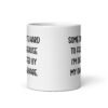 White ceramic mug with the phrase 'Some days it's hard to focus because I'm distracted by my own cleavage' printed on both sides.